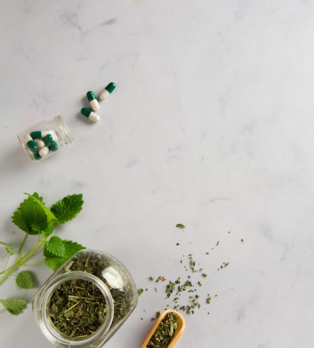 top-view-jar-with-herbs-capsules-table